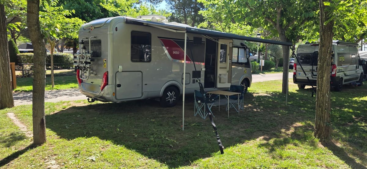 Our motorhome back on its shaded pitch at the campsite, awning out